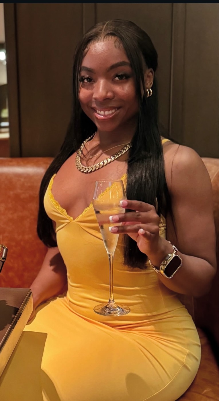 Fitcynn holding a mimosa